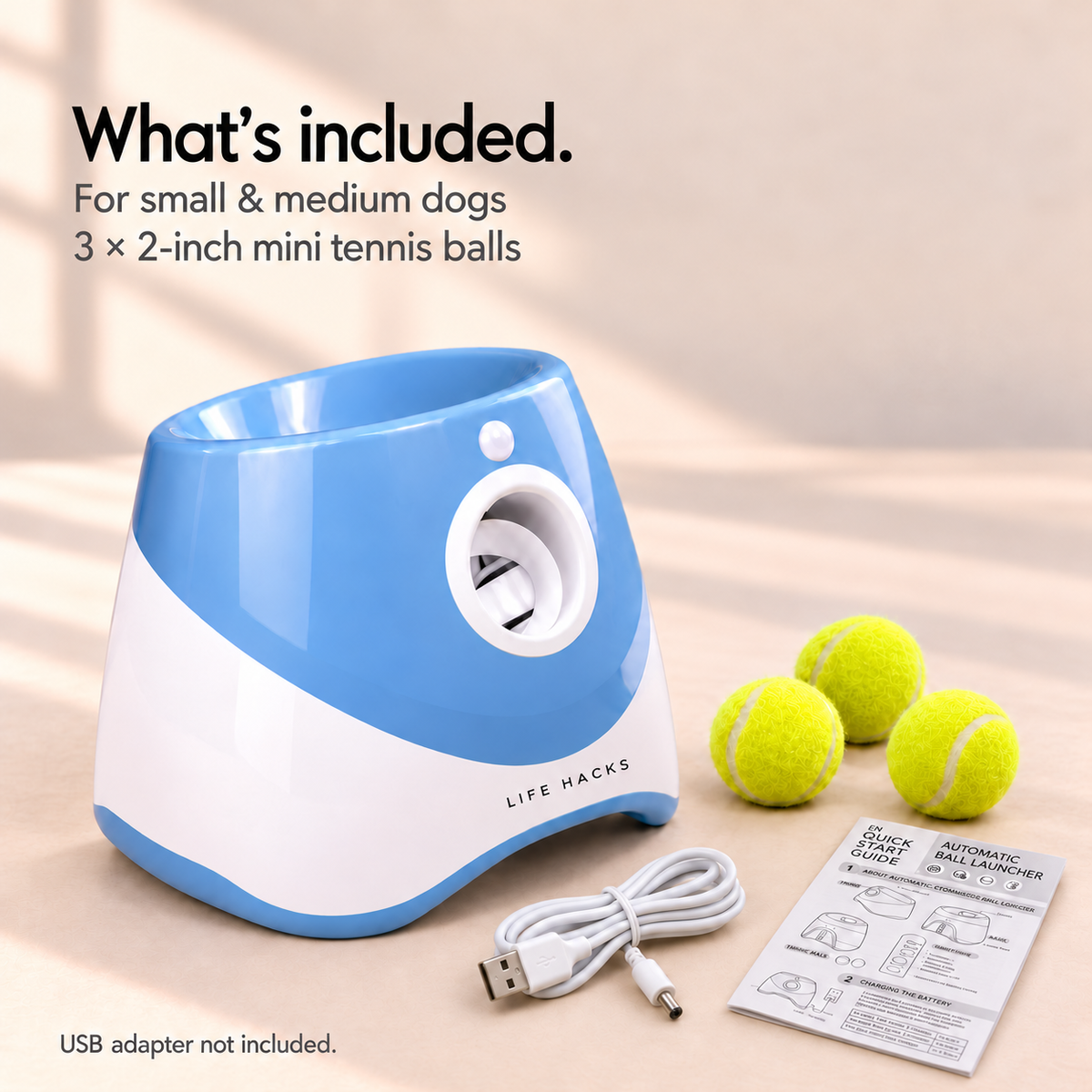 Blue launcher with three 2-inch balls, white USB charging cable and user manual